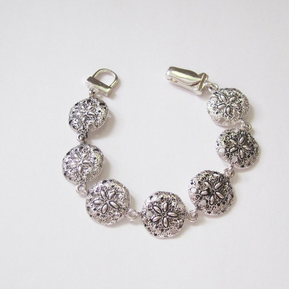 Burnished  silver tone metal sand  dollar bracelet